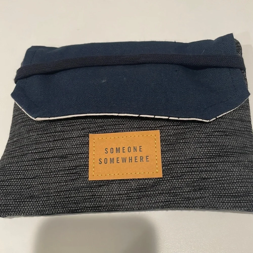 Delta One Someone Somewhere Artisan-Made Amenity Kit. Navy and Charcoal. NEW